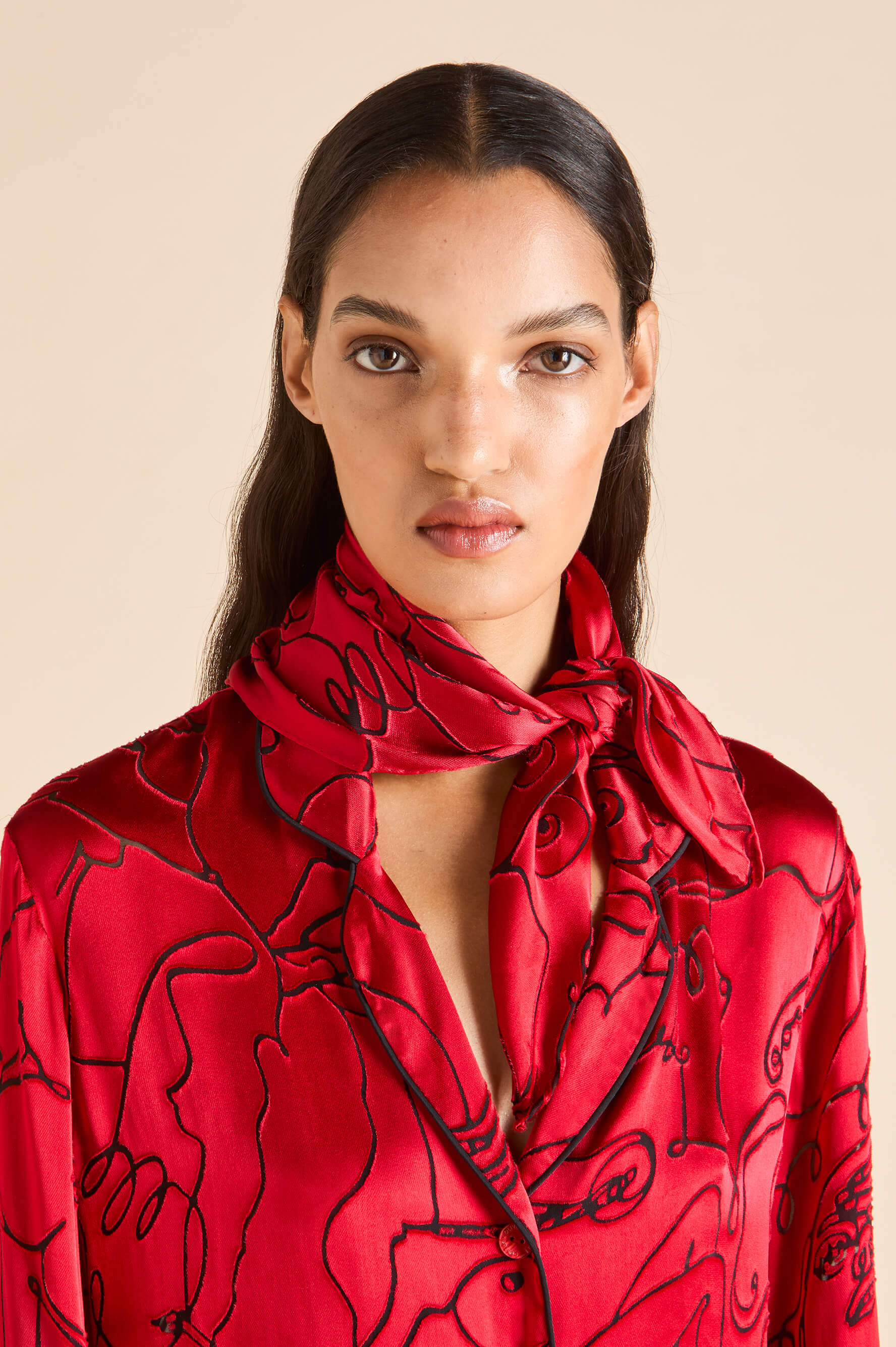 olivia von halle red silk scarf with black figure detail